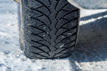 Winter tire tread on snow on a frosty day