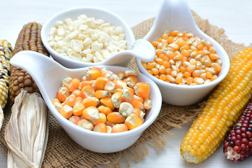 grains of natural corn in containers
