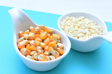 grains of natural corn in containers