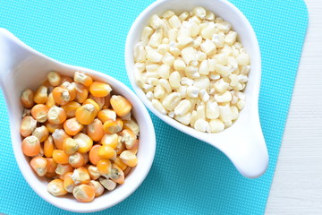 grains of natural corn in containers
