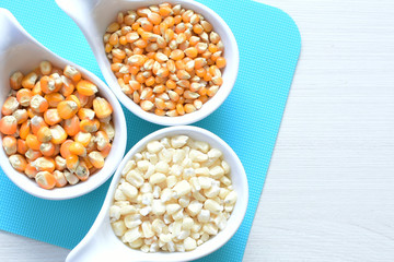 grains of natural corn in containers