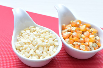 grains of natural corn in containers