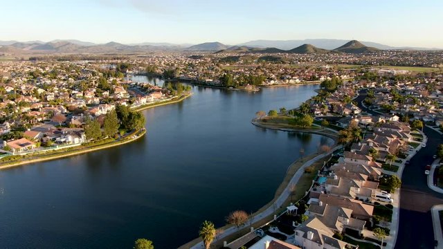 Aerial view of Menifee Lake and neighborhood, residential subdivision vila during sunset. Riverside County, California, United States