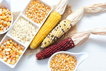 grains of natural corn in containers