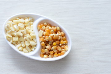 grains of natural corn in containers