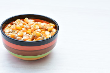 grains of natural corn in containers