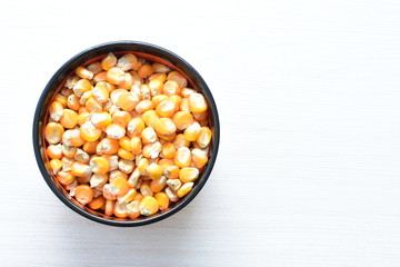grains of natural corn in containers