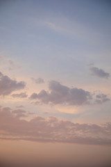 Moody evening sky in pink and grey shadows clouds