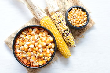 grains of natural corn in containers
