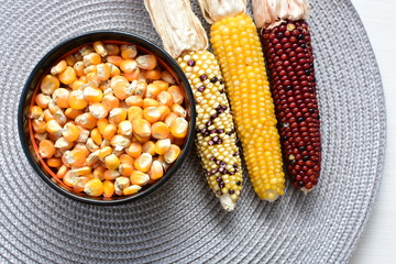 grains of natural corn in containers