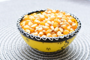 grains of natural corn in containers
