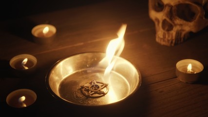 Burning pentacle on altar closeup photo