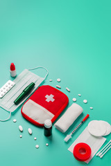 Creative layout of medicines for first aid, first aid kit for tourists, bandages, painkillers,...