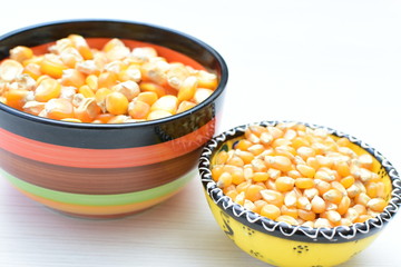 grains of natural corn in containers