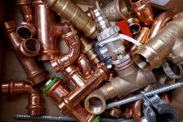 Small material for plumbers and heating installers. Copper, brass, steel, pipes, angles.