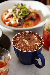 Cafe mocha with risotto on background 
