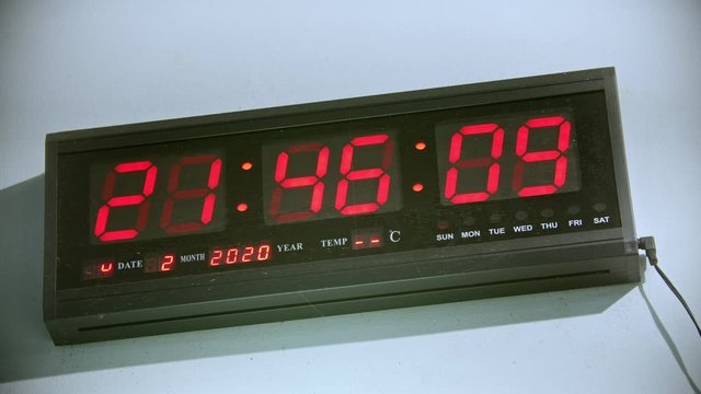 Watch showing time on the wall in the gym