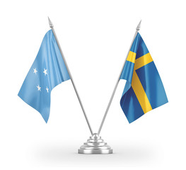 Sweden and Micronesia table flags isolated on white 3D rendering
