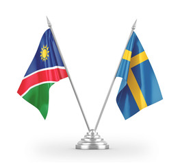 Sweden and Namibia table flags isolated on white 3D rendering