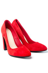 Women's red high-heeled shoes isolated on a white background