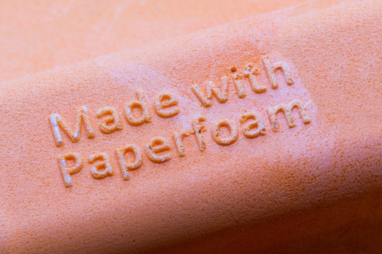 Text Made With Paperfoam On Orange Cosmetic Package. Close Up, Macro