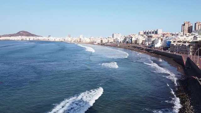 Drone footage of Las Canteras Beach (Playa de Las Canteras (Las Palmas de Gran Canaria)) and surfers