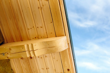 Pine wooden roof structure. House exterior