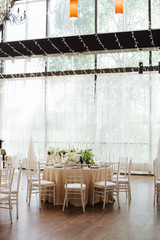 wedding table with flowers  in restaurant
