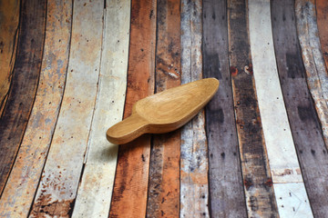 A small brown spoon made of wood