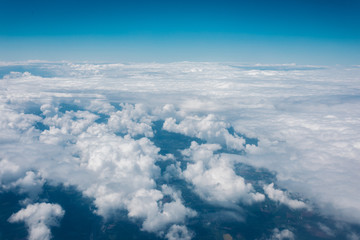 Fototapeta na wymiar Sky with clouds from airplane window during flight.
