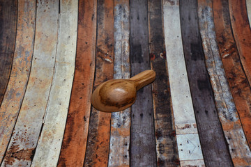 A small brown spoon made of wood