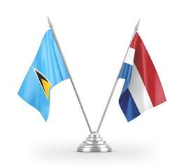 Netherlands and Saint Lucia table flags isolated on white 3D rendering