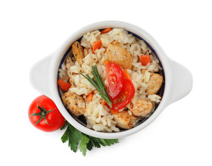 Delicious chicken risotto and fresh tomato with parsley isolated on white, top view