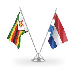 Netherlands and Zimbabwe table flags isolated on white 3D rendering