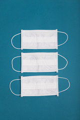 Medical mask against a virus on a blue background