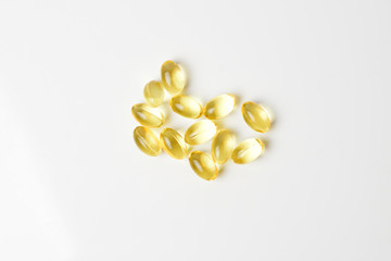 Fish oil pills on a white background. Copy space.