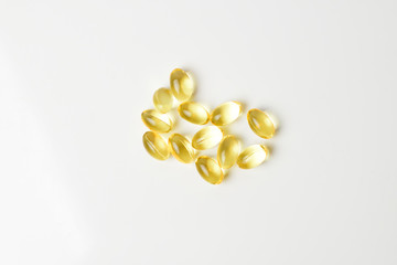 Fish oil capsules on a white background. Copy space.