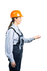 A female civil engineer stands sideways and reaches out to take something. Isolated