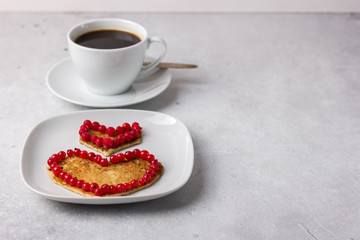 Composition with pancakes in the form of a heart on Valentine's Day, Women's Day or Mother's Day