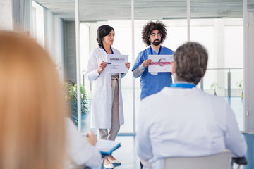 Group of doctors talking about corona virus on conference.