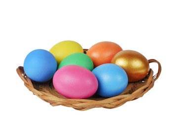 Fototapeta na wymiar Colorful Easter eggs in the basket on the white background