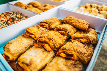 Many salty buns pastry vegan as food for a group of people.