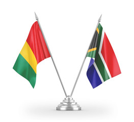 South Africa and Guinea table flags isolated on white 3D rendering