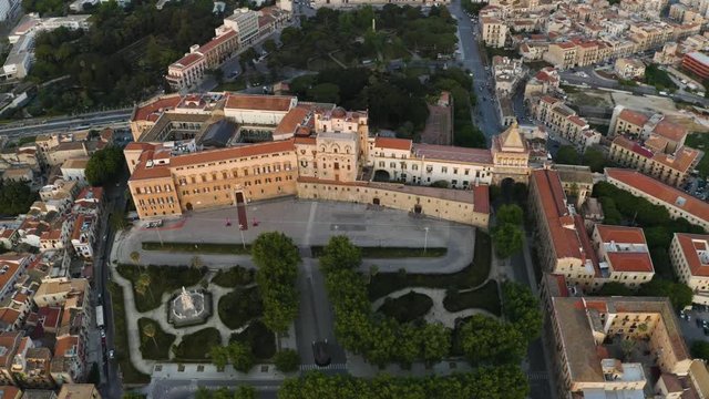 Cinematic flight in the pre-dawn hour over the Palazzo dei Normanni, and Cappella Palatina in the historic part of Palermo. Sicily. Aerial shoot