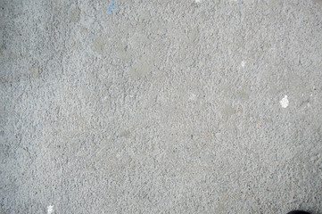 Wall made of gray solid, rusty, embossed building concrete. Texture, background