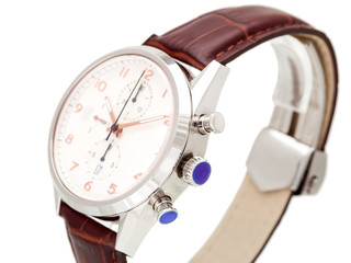 elegantly designed men's wrist watch made of silver and brown leather strap, dial with hands and numbers, close up side view.