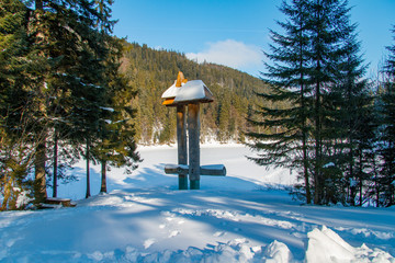 Ice-covered alpine lake Synevyr. Carpathian mountains, Ukraine. February 2013