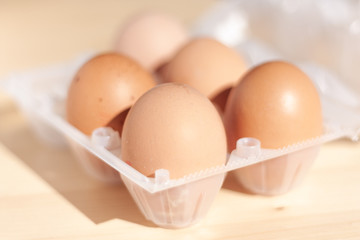 Eggs in wicker bascket in the morning light