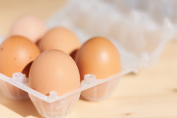 Eggs in wicker bascket in the morning light