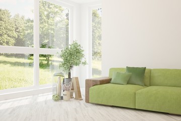 Fototapeta premium Stylish room in white color with sofa and summer landscape in window. Scandinavian interior design. 3D illustration